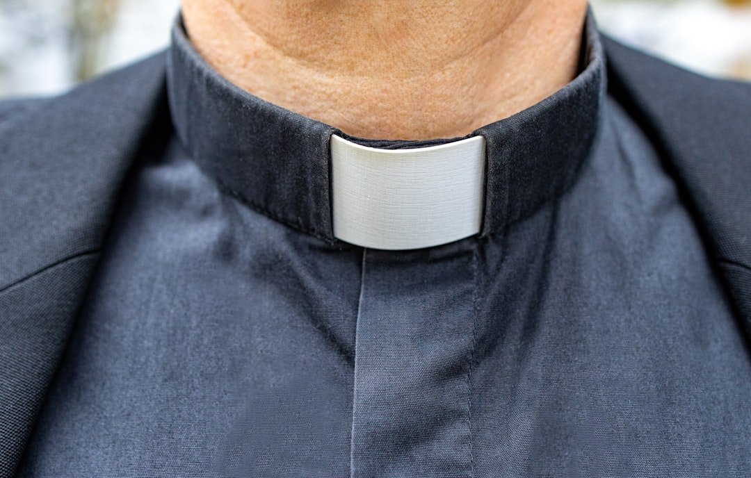 a close up of a man wearing a neck tie